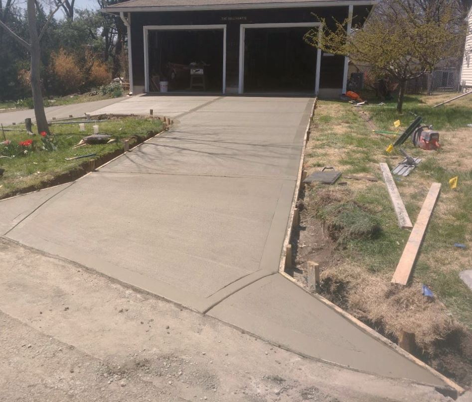 our team working on a concrete driveway